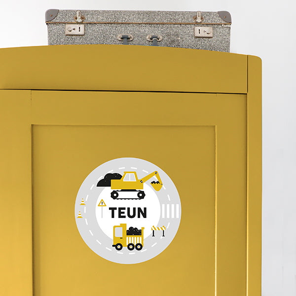Deursticker rond Graafmachine met naam - oker geel